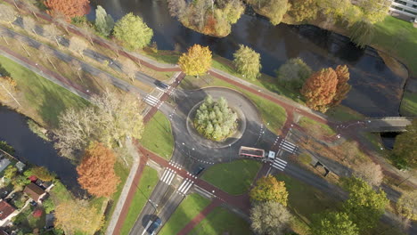 High-angle-view-of-a-busy-roundabout-in-the-Netherlands---drone-slowly-setting-down
