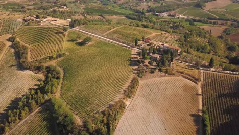droneshot-slow-turn-left-and-tilt-up-over-Tuscan-landscape-in-Italy-in-4K