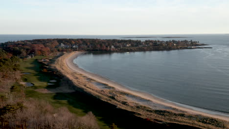 Stunning-aerial-wide-angle-on-Prouts-Neck-beach-in-Scarborough,-Maine