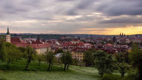Sunrise-timelapse-of-Prague,-Czech-Republic-as-seen-from-the-orchards-of-Petrin-gardens-with-a-view-of-the-St
