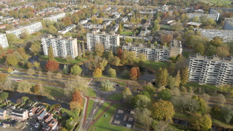 Beautiful-aerial-towards-busy-roundabout-in-a-idyllic-town-in-the-Netherlands