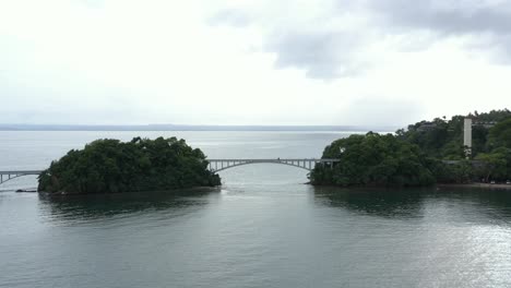 Long-pedestrian-bridge-and-Bahia-Principe-Grand-Cayacoa-resort,-Samana-bay-in-Dominican-republic