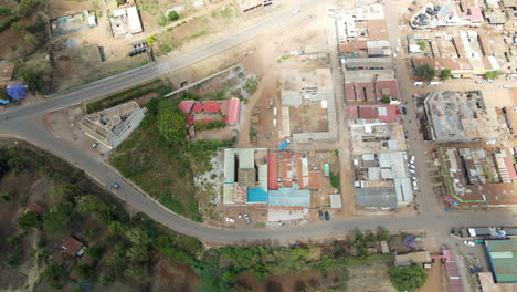 Slow-aerial-reveal-of-the-outer-edges-of-a-busy-city-in-Kenya
