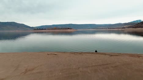 AWESOME-CLOSE-TO-GROUND-DRONE-SHOT-AND-BEAUTIFUL-LANDSCAPE-AT-PINEVIEW-WATER-RESERVOIR-IN-UTAH