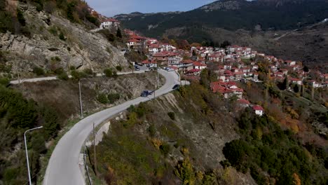 Aerial-drone-view-of-famous-metsovo-when-a-car-pass-in-epirus-in-greece