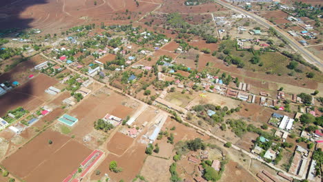 High-jib-down-of-a-small-town-with-green-trees-in-beautiful-Kenya