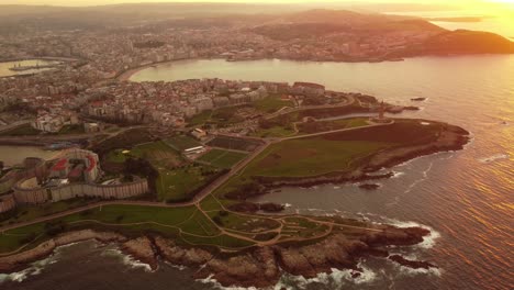 Aerial-view-of-la-coruna-city-Galicia-region-north-of-Spain,-urban-city-center-and-natural-landscape-ocean-cliff-panorama