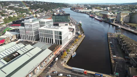 Cork-City,-Republic-of-Ireland,-Drone-Aerial-View-of-Bridge-Traffic-on-River-Lee-and-Buildings-on-Riverbanks-on-Sunny-Autumn-Day