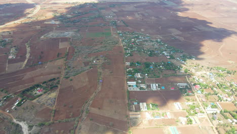 High-jib-down-of-a-beautiful-landscape-in-Kenya-with-green-farms
