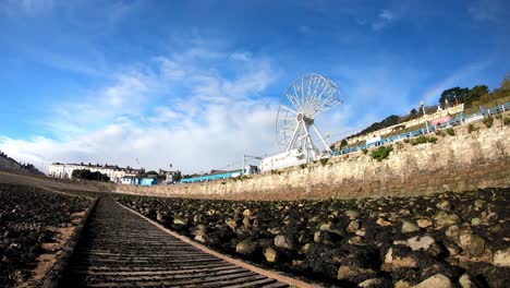 Clouds-passing-above-rotating-Llandudno-pier-Ferris-wheel-attraction-dismantling-at-end-of-tourism-season-2021-time-lapse