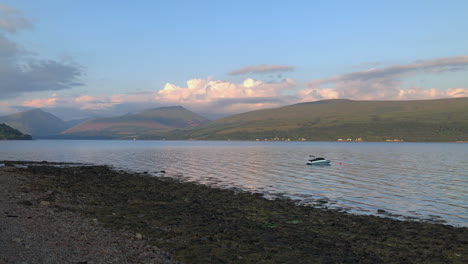Scenic-View-Of-Mountains-And-Loch-Fyne-With-Boat-Adrift-From-Inveraray-In-Argyll-and-Bute,-Scotland