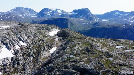 Patches-Of-Snow-In-The-Summit-Of-Mount-Katthammaren-Norway---aerial-shot