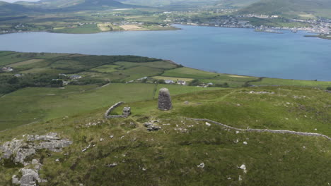 Rocky-Castle-Ruins-on-Dingle-Peninsula-Grassy-Hill-in-Ireland,-Aerial