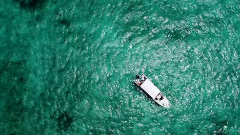 Aerial-View-of-a-fishing-boat-in-the-middle-of-the-Caribbean-sea
