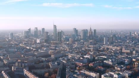 Fly-back-view-of-Warsaw-Poland-city-center-full-of-tall-buildings-in-Europe