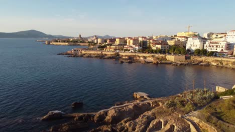 Drone-shot-flying-over-the-Mediterranean-Sea-on-the-coast-of-Alghero,-Italy