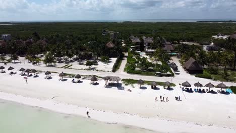 Aerial-View-of-Small-Beach-Town-with-White-Sand-Shore-in-Mexico