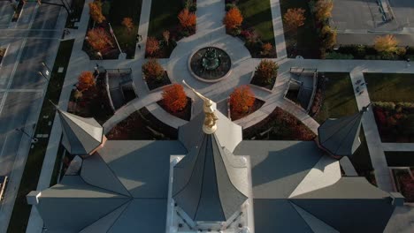 Angel-Moroni-Golden-Statue-on-top-of-LDS-Mormon-Temple-Building-in-Provo,-Utah---Aerial