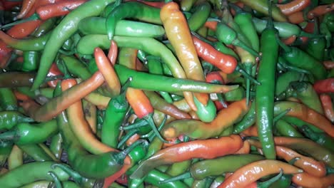 A-lot-of-Red-and-Green-Chili-Peppers-on-the-Shop-Shelf-in-the-Supermarket