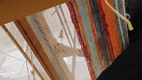 Unique-view-from-underneath-a-traditional-loom-in-use