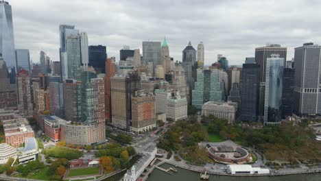 Aerial-view-of-skyscrapers-in-lower-Manhattan,-in-cloudy-NYC---tracking,-drone-shot