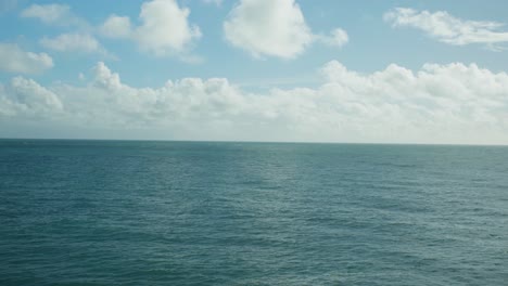 4K-Slow-motion-panoramic-landscape-shot-of-the-ocean-on-a-sunny-day