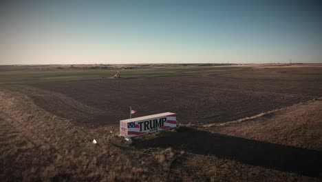 Dark-and-Gloomy-Drone-Video-of-Donald-Trump-Supporter-Farm-Land-Owner-with-Giant-Trump-2024-Campaign-Sign-Encouraging-People-to-Vote-For-Republican-President