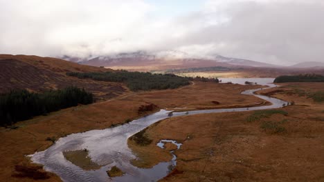 AERIAL---River-Orchy,-Glencoe,-Scottish-Highlands,-Scotland,-wide-reverse-shot