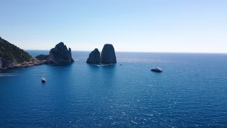 Aerial-Drone-footage-view-of-Faraglioni-Rocks-in-Sea-in-Capri-Naples-Costiera-Amalfitana-Italy-Europe-no-video-editing