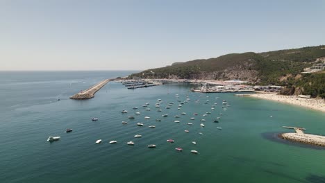 Aerial-view-around-Fishing-Harbor-coastal-village-Sesimbra-with-mesmerizing-clear-water---Portugal