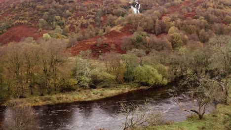 AERIAL---River-Falloch-and-Ben-Glas-burn-waterfall,-Glencoe,-Scottish-Highlands