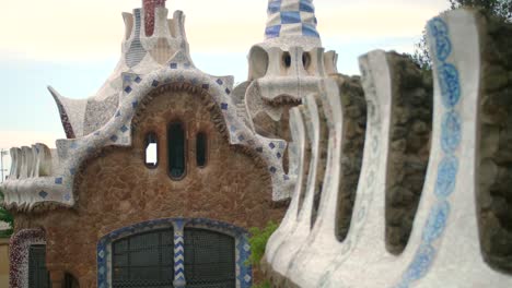 Mosaic-Tile-Roofs-Of-Casa-del-Guarda-Gatehouse-At-Park-Guell-In-Barcelona,-Catalonia,-Spain