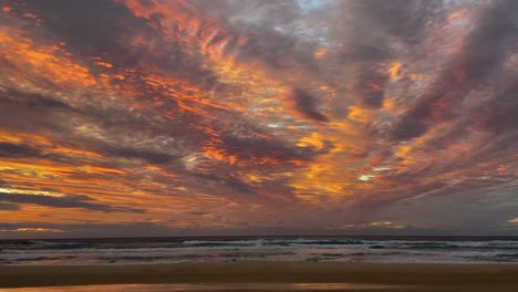 Amazing-and-dramatic-sunrise-or-sunset-on-Australia's-Fraser-Island,-with-a-stunning-orange-and-gold-palette-like-an-oil-painting