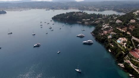 Aerial-view-of-corfu-island-with-boats-at-komeno-bay