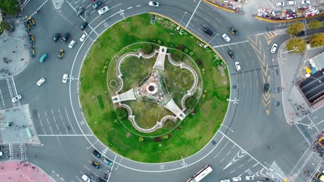 Aerial-view-of-Plaça-d'Espanya-in-Barcelona-showing-some-traffic-and-people-walking-in-a-roundabout