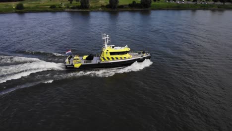 Dutch-law-enforcement-vessel-sailing-on-a-river