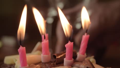 Chocolate-birthday-cake-with-candles-macro-shot