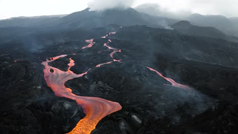 Drone-flying-backwards-and-revealing-lava-streams-from-the-Cumbre-vieja-volcano