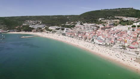 Aerial-panoramic-view-of-Sesimbra-beach,-Portugal