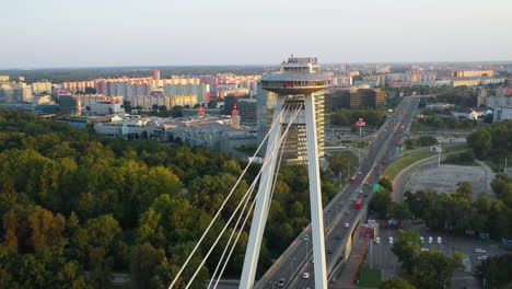 Revealing-drone-shot-of-the-Bridge-of-the-Slovak-National-Uprising-starting-near-the-observation-deck-in-Bratislava,-Slovakia