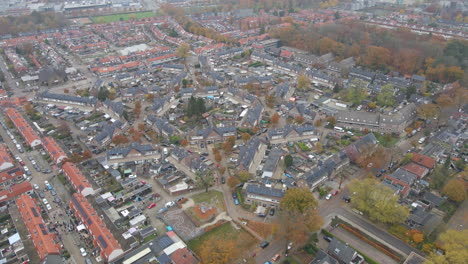 Aerial-of-a-small-town-with-houses-with-solar-panels-on-rooftops