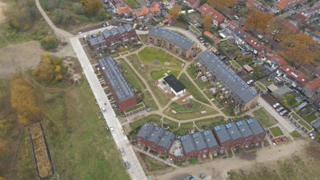 High-angle-aerial-of-a-new-suburban-neighborhood-with-solar-panels-on-rooftop