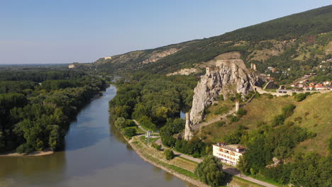 Rotating-cinematic-drone-shot-of-Hrad-Devin-castle-in-Bratislava,-Slovakia-with-river