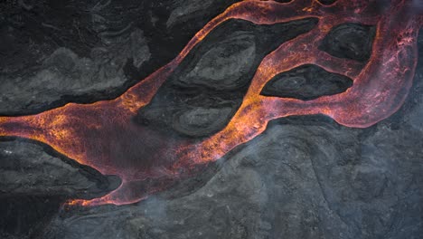 top-down-rising-drone-shot-from-Cumbre-Vieja's-lava-streams-in-La-Palma
