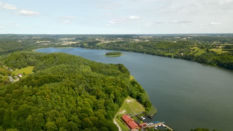 Brodno-Wielkie-Lake-in-Early-Autumn-with-Green-Forests-on-Riverbanks---Arial-high-raise-view