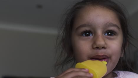 Little-Four-Year-Old-UK-Asian-Girl-Eating-Ice-Lolly