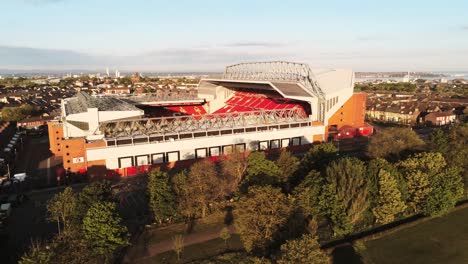 Iconic-Anfield-Liverpool-football-club-stadium-at-sunrise-aerial-descending-view