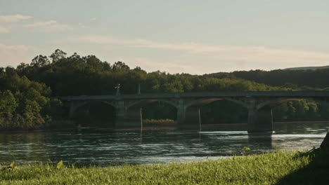 Historic-bridge-over-Susquehanna-River-in-Watsontown,-Pennsylvania,-Pan-Left