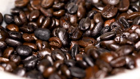 Roasted-coffee-beans-falling-into-the-grinder