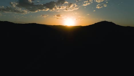 Aerial-panning-right-shot-of-a-sunset-in-the-Black-Hills